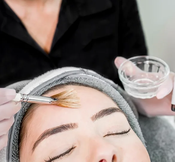 A facial treatment being applied in the treatment room