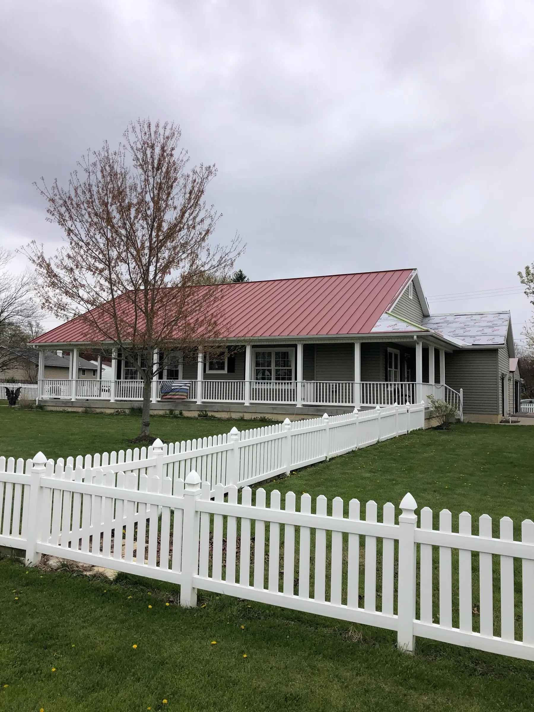 Red standing seam metal roof on an Ohio farmhouse